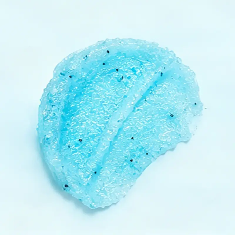 Blue coconut oil sugar scrub texture with sugar crystals for gentle body exfoliation